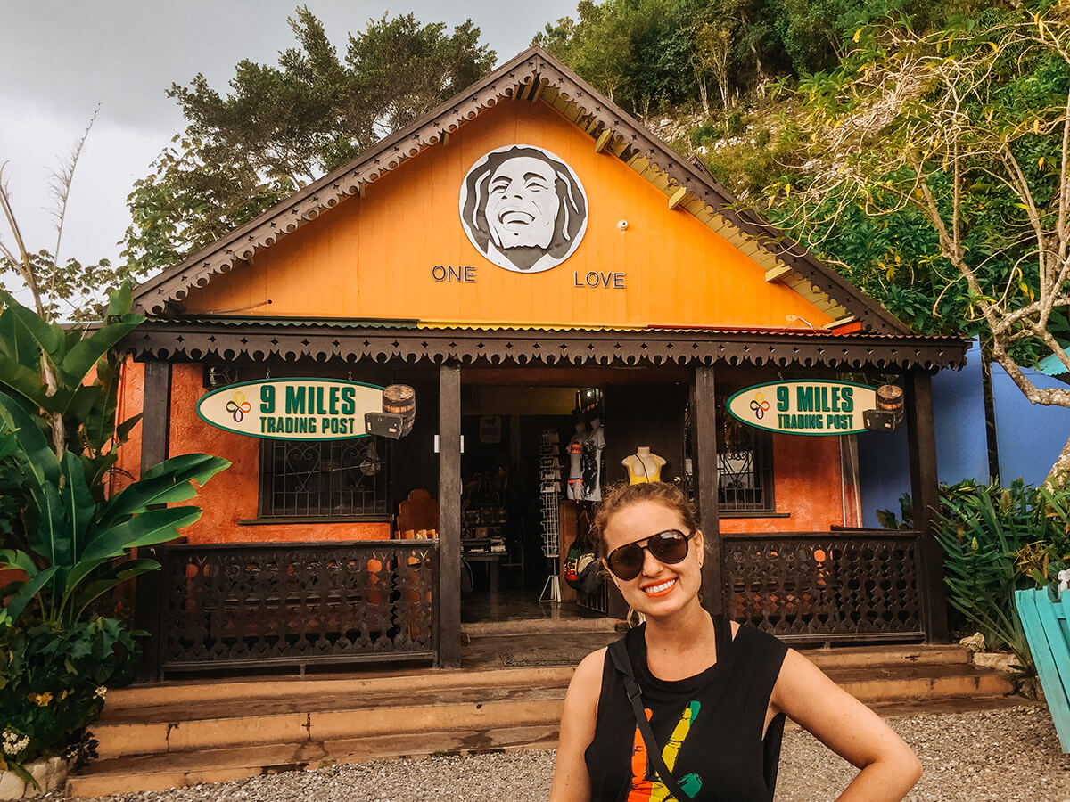 in front of Bob Marley One Love Cafe